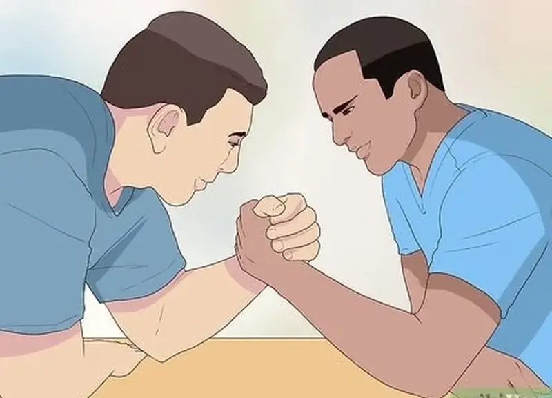 Đấu vật tay đối kháng thể hiện sự quyết tâm